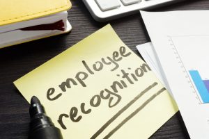 Employee recognition handwritten on a memo stick.